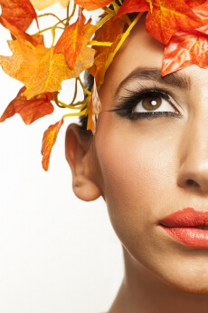 beautiful young woman portraying autumn