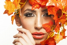 beautiful young woman portraying autumn