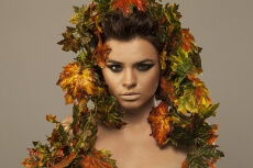 woman covered in leaves 