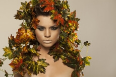 woman covered in leaves 