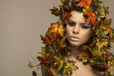 woman covered in leaves 