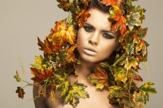 woman covered in leaves 
