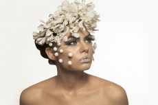woman covered with white flowers