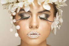 woman covered with white flowers