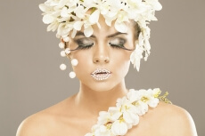 woman covered with white flowers