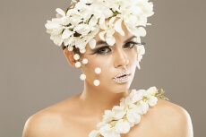 woman covered with white flowers