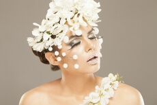 woman covered with white flowers