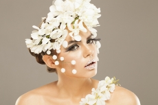 woman covered with white flowers