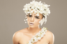 woman covered with white flowers