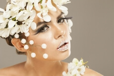 woman covered with white flowers