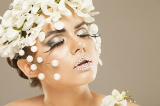 woman covered with white flowers