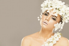 woman covered with white flowers