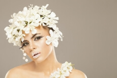 woman covered with white flowers