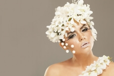 woman covered with white flowers