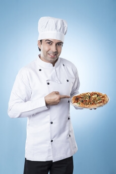 chef posing with pizza