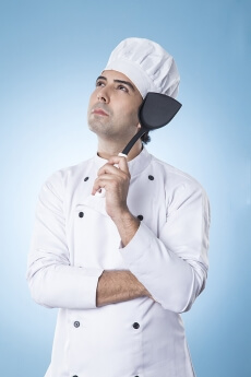 chef thinking with spatula in hand