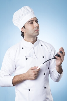 chef thinking with spatula in hand
