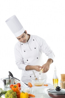 chef adding oil to the bowl 