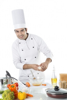 chef adding oil to the bowl 