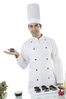 chef with cupcakes
