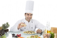chef adding ingredient 