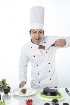 chef with cake and muffins 