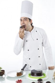 chef with cake and muffins 