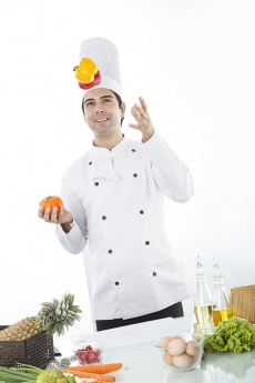 chef tossing up capsicum