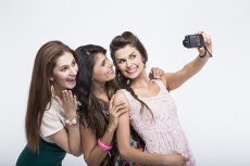 girls taking selfie