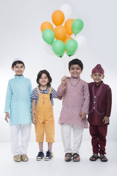 kids from different religions with balloons 