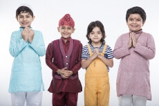 kids from different religions praying with folded hands