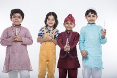 kids from different religion praying with candles