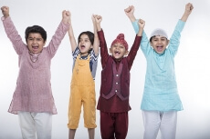 kids raising hands in excitement