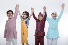kids raising hands in excitement
