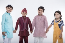 kids from different religions holding each others hands 