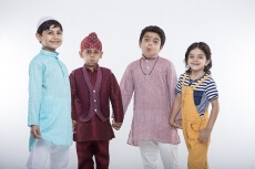 kids from different religions holding each others hands 