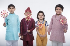 kids from different religions with windmill toy