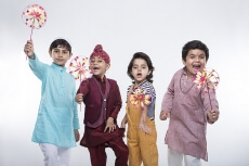 kids from different religions with windmill toy