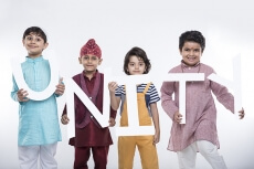 kids posing with alphabets