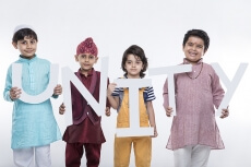 kids posing with alphabets