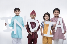 kids posing with alphabets