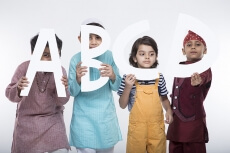 kids peeking through alphabets