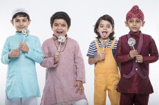 four kids posing with candy 