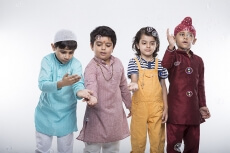 four kids from different religion playing with bubbles