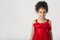 girl wearing red dress gesturing