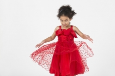 girl wearing red dress gesturing