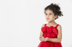 girl wearing red dress gesturing
