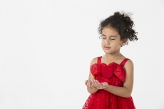 girl wearing red dress gesturing