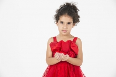 girl wearing red dress gesturing