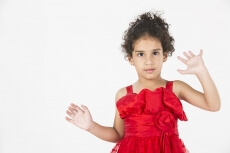 girl wearing red dress gesturing
